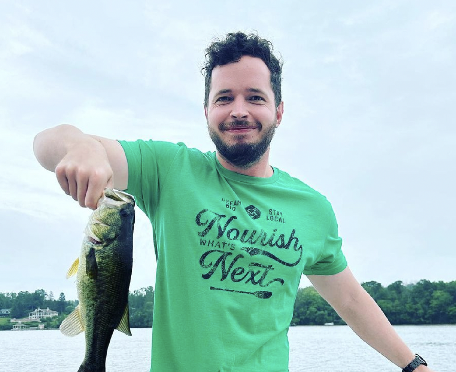 Fisherman holding up fish